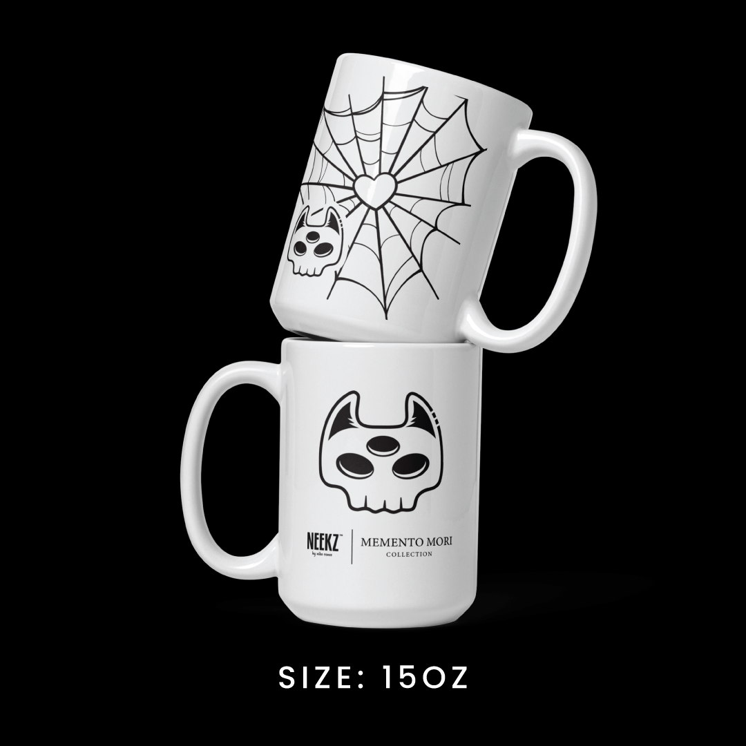 Stacked view of the 15oz mug from the Memento Mori collection, featuring Manxx the Magician graphics.