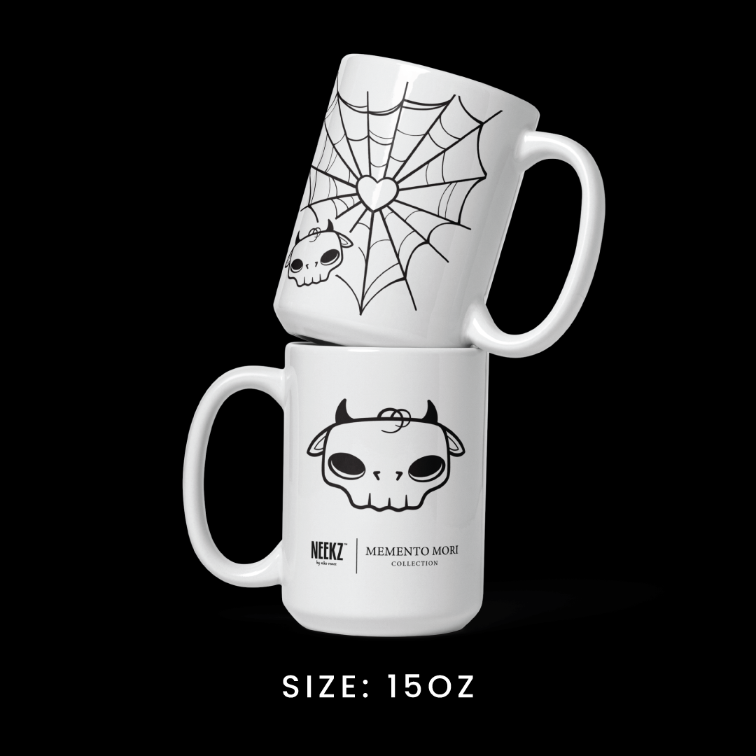 Stacked view of the 15oz mug from the Memento Mori collection, featuring Tobi the Peacemaker graphics.