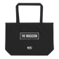 Jumbo black tote bag with white "The Magician Archetype" text imprinted on the back.